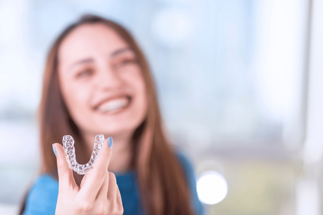dentist showing clear aligners