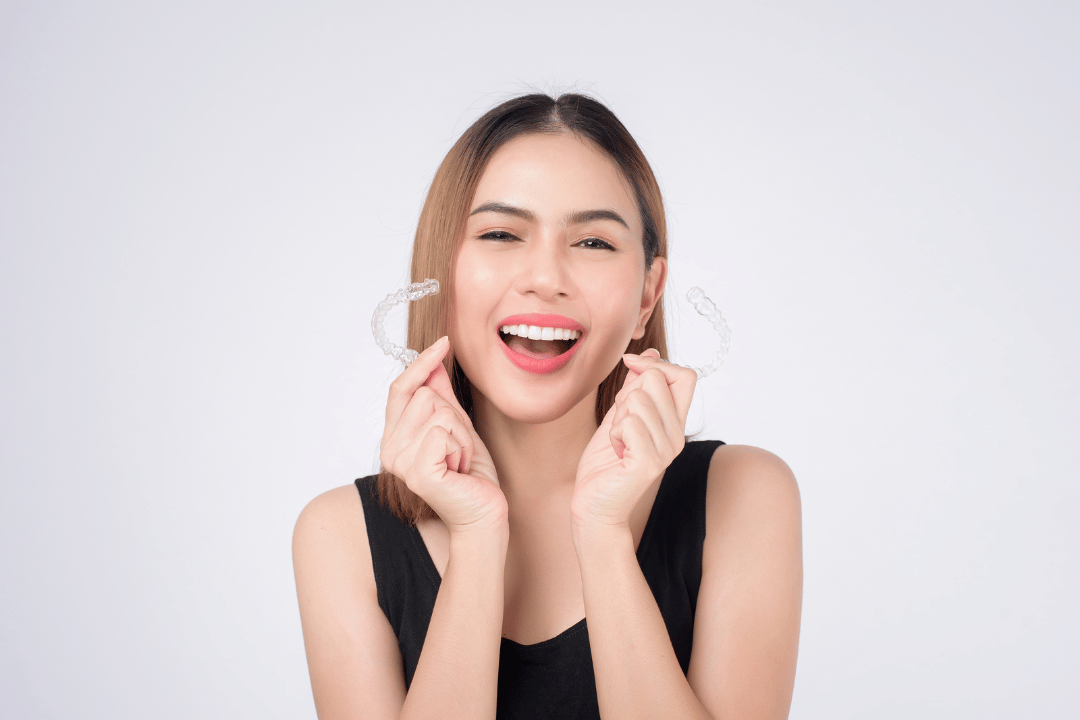 woman smiling with Invisalign