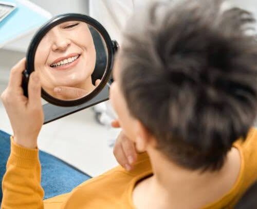 dental-implants-williamsburg-ny-result Patient smiling after dental implant treatment near Williamsburg, NY